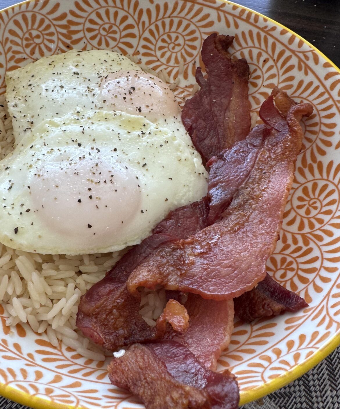 Two over easy eggs, minute rice and thick cut bacon- Brunch