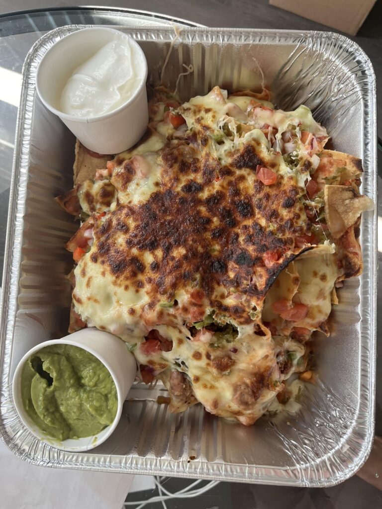 Stopped to get some takeout nachos from Sneaky Dee’s and they handed me this