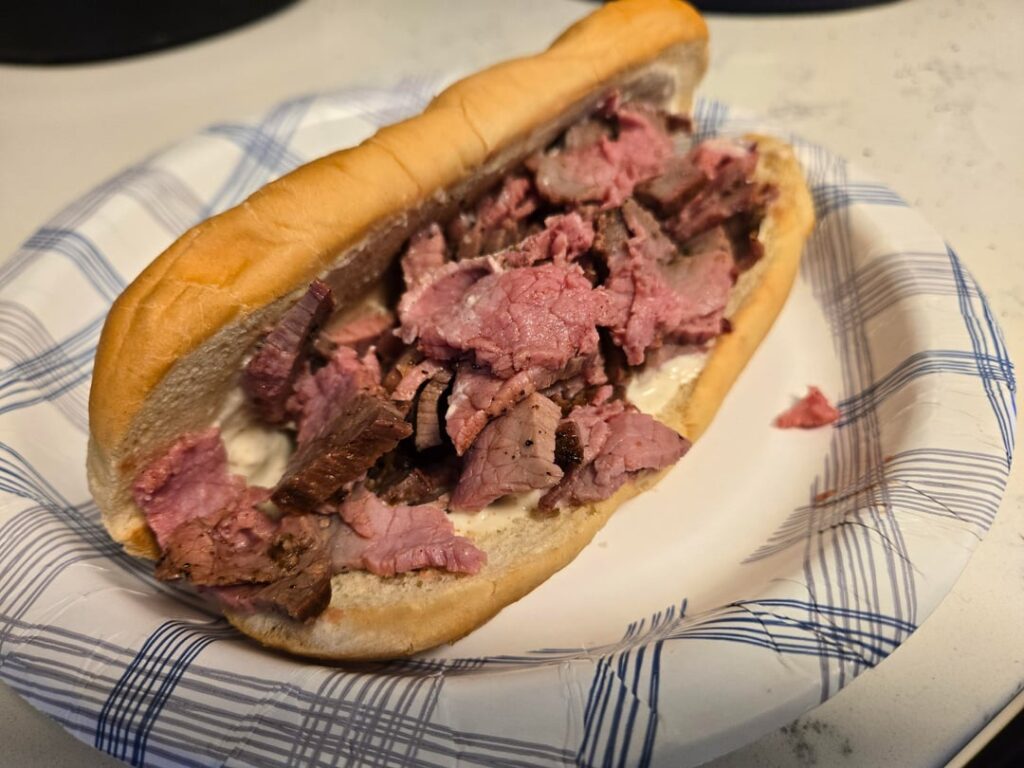 Grilled beef roast on toasted roll