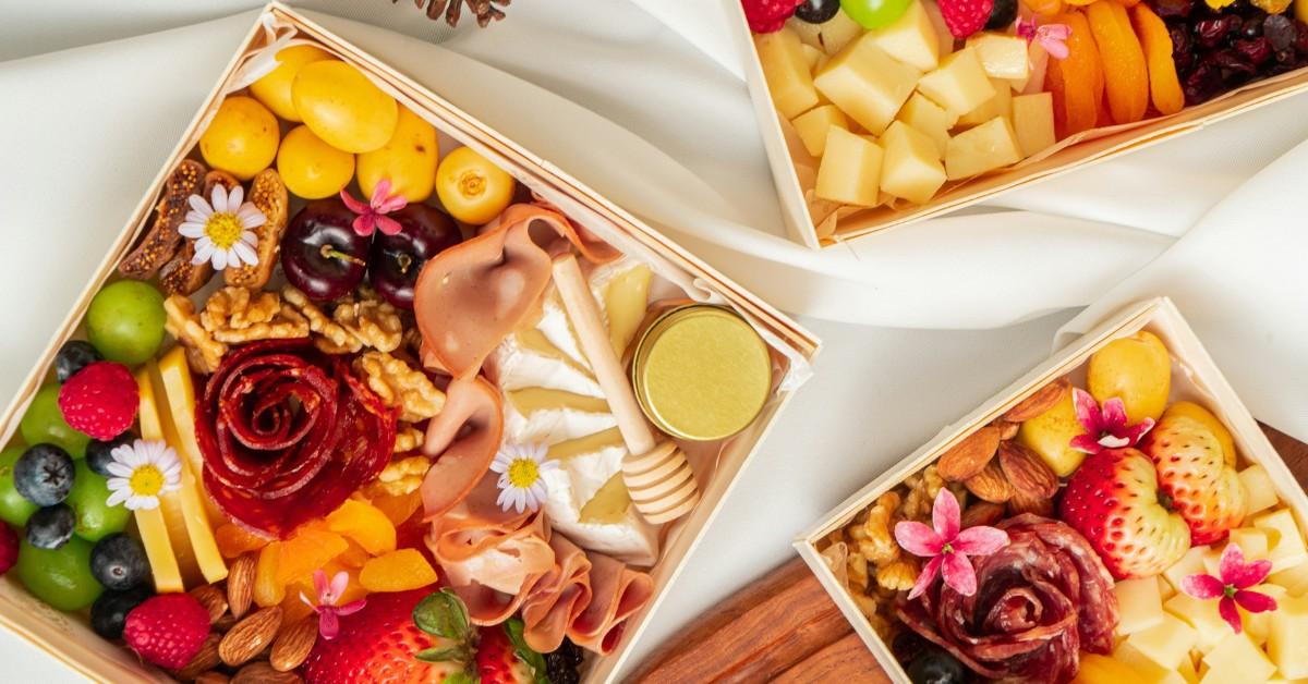 Cold cut spreads featuring fruits, meats, and cheeses