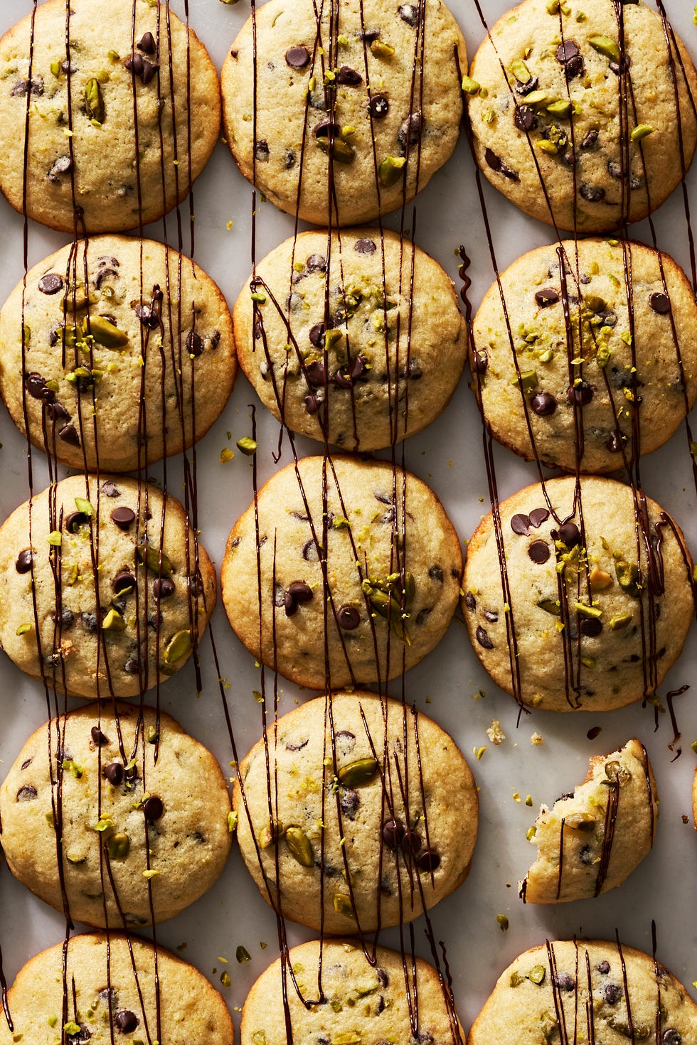 cannoli cookies with chocolate chips and pistachios, drizzled with chocolate