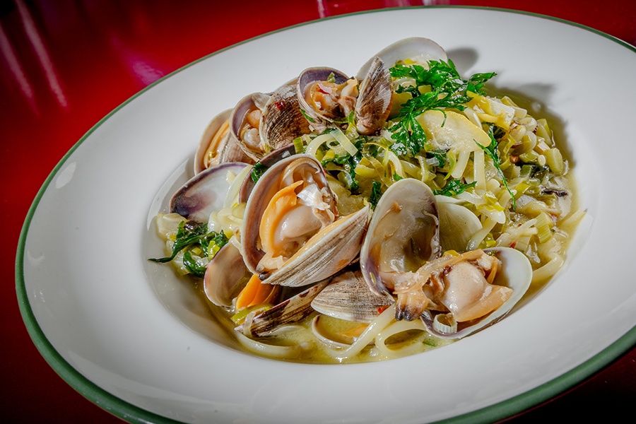 Clams, linguine, and herbs in a light sauce.