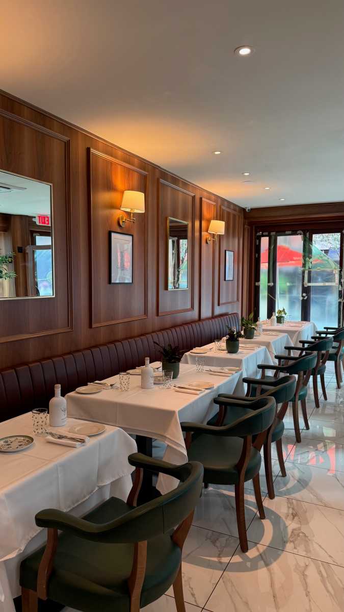 tables and chairs inside CASASALVO restaurant in Soho