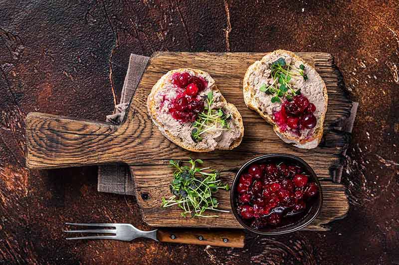 Duck Rillettes Pate Toasts With Sprouts On A Wooden Board