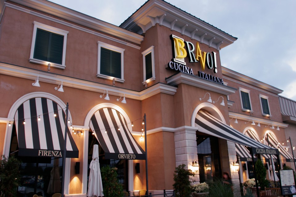 Bravo! Cucina Italiana restaurant exterior at dusk.