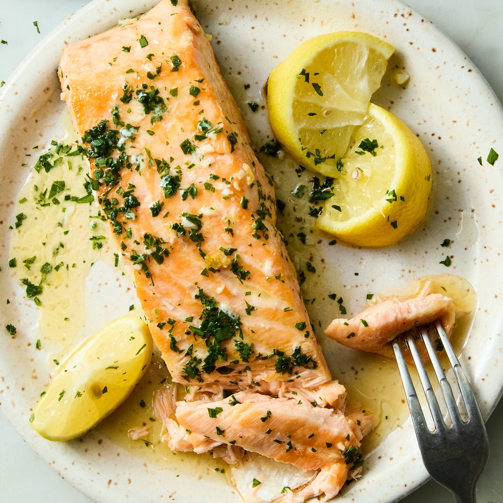 hearty salmon filets are generously seasoned with salt and pan seared in browned butter lemon zest and lemon juice, then topped with a flurry of freshly chopped herbs