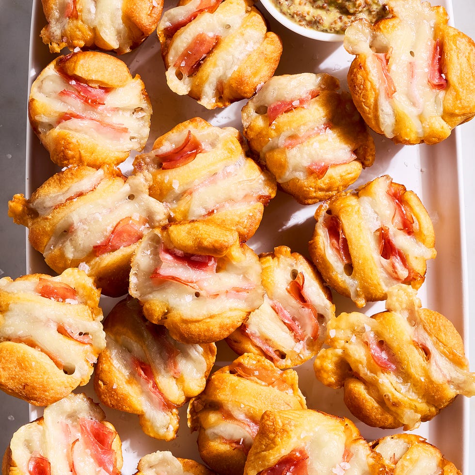 ham and swiss hasselback biscuit bites on a tray