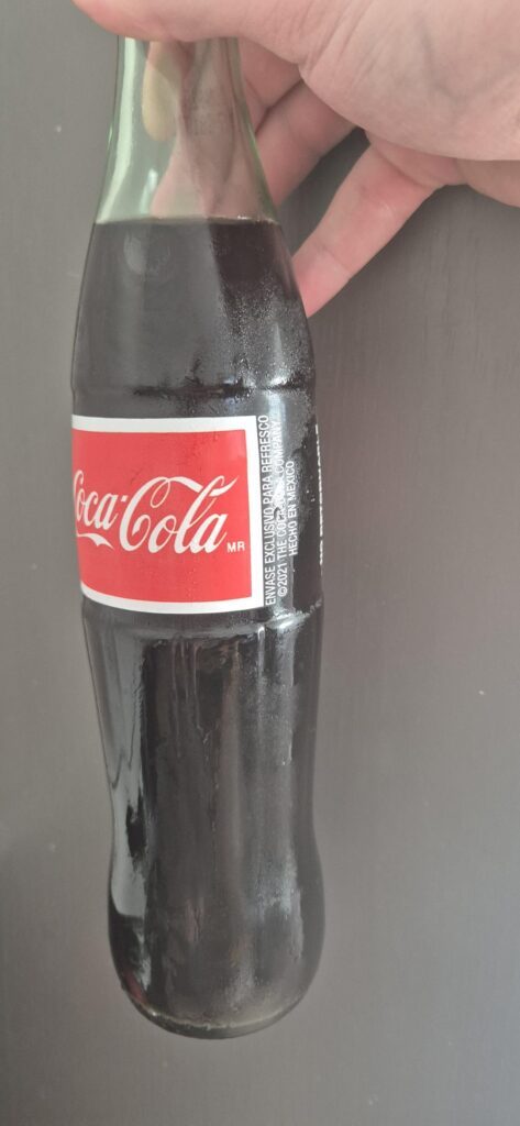 Off licence has some Mexican coca cola, this cane sugar is great