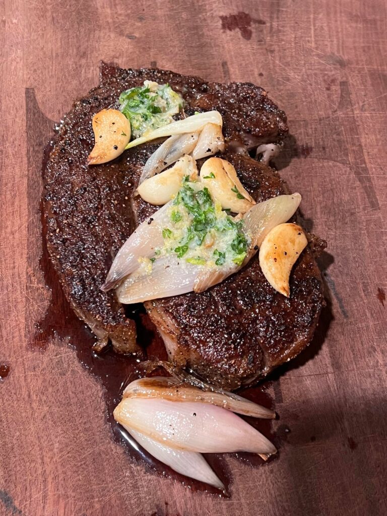 What temp do you pull your steaks out of the over to get a perfect medium rare?