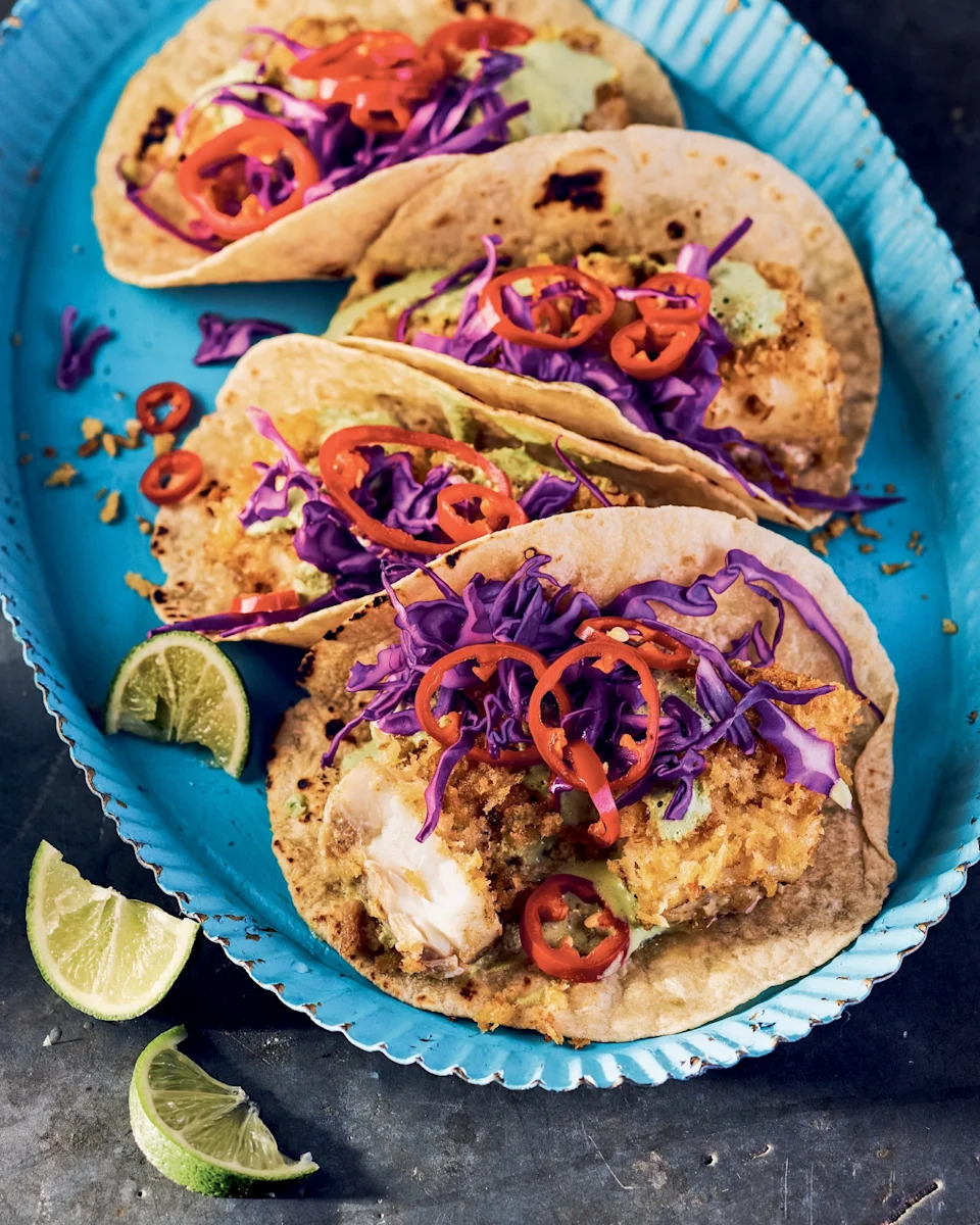 Lauren Volo - PHOTO: A plate of crispy fish tacos with slaw and pickled peppers.