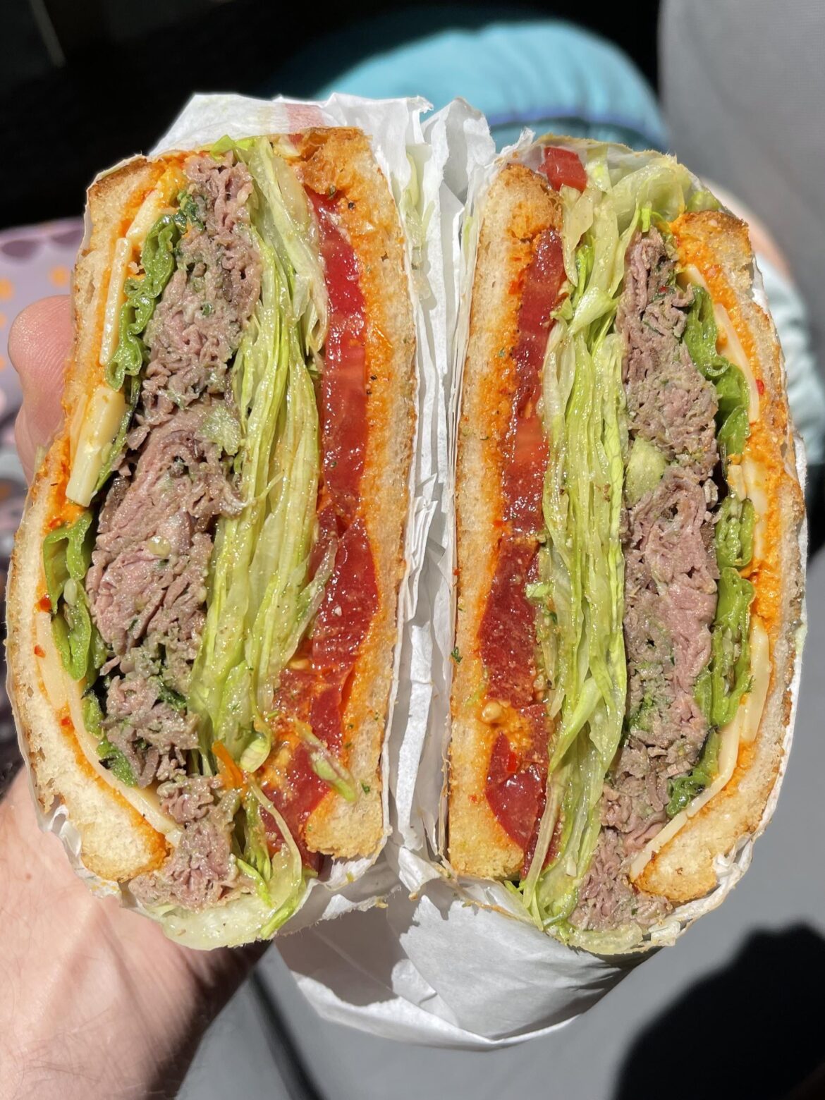 [homemade] Chimichurri’d roast beef, seasoned heirloom tomato, shredded dressed iceberg, blistered shishitos, Jimmy Nardello and early girl hazelnut romesco, vintage white cheddar.