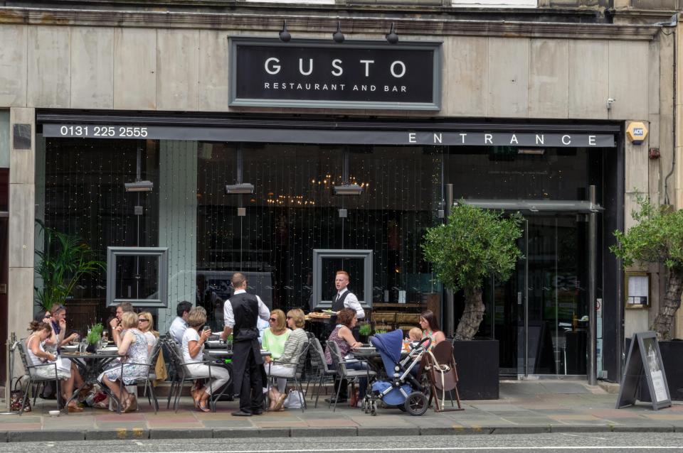Patrons dining outside Gusto Restaurant and Bar in Edinburgh.