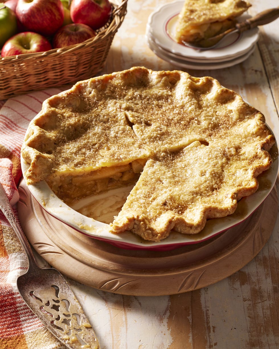 double crust brown butter apple pie in a pie dish with a slice removed