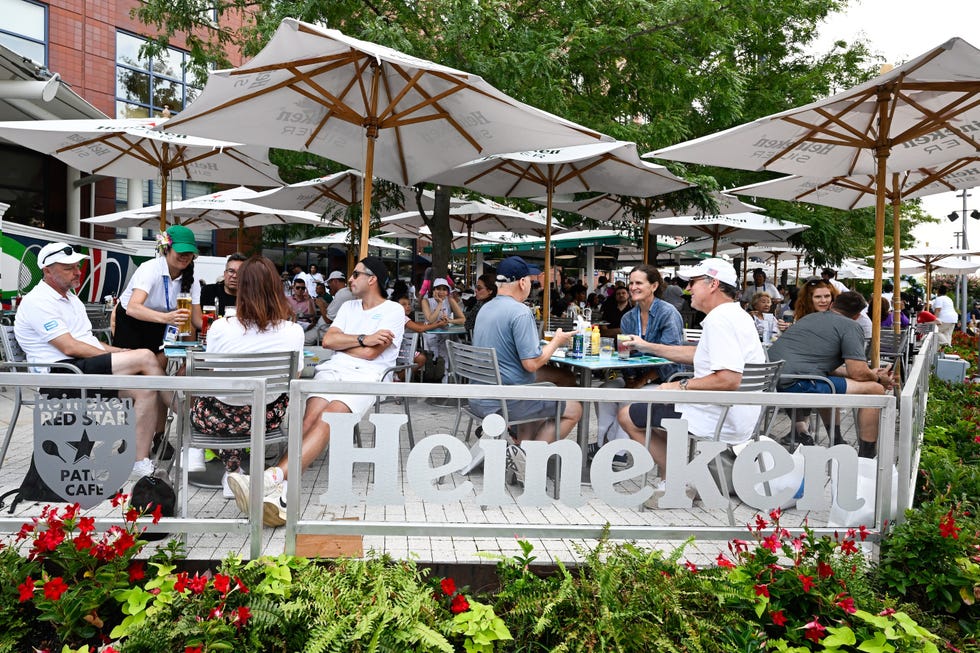 people enjoy the heineken red star patio café at the 2024 us open on monday, aug 26, 2024 in flushing, ny david dowusta