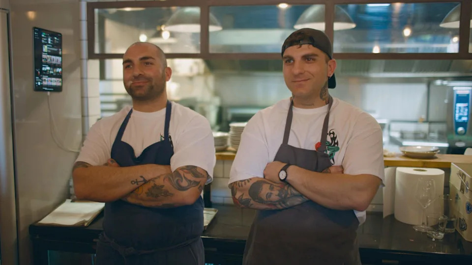 Niccolò and Manuel Trecastelli wait eagerly for Stanley Tucci’s reaction to their sandwich in Tucci in Italy