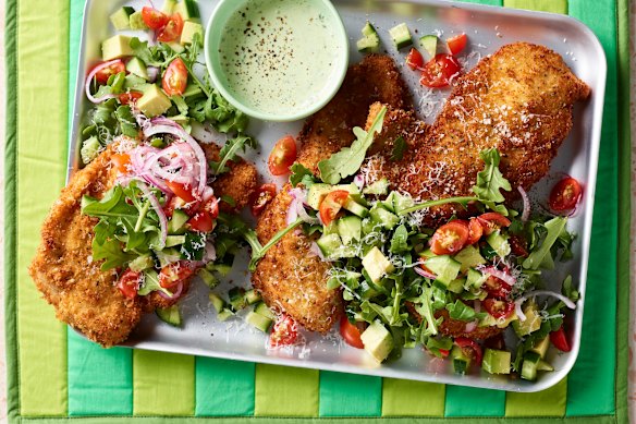 Buy crumbed schnitties or crumb your own for chicken schnitzel with tomato, rocket and basil.