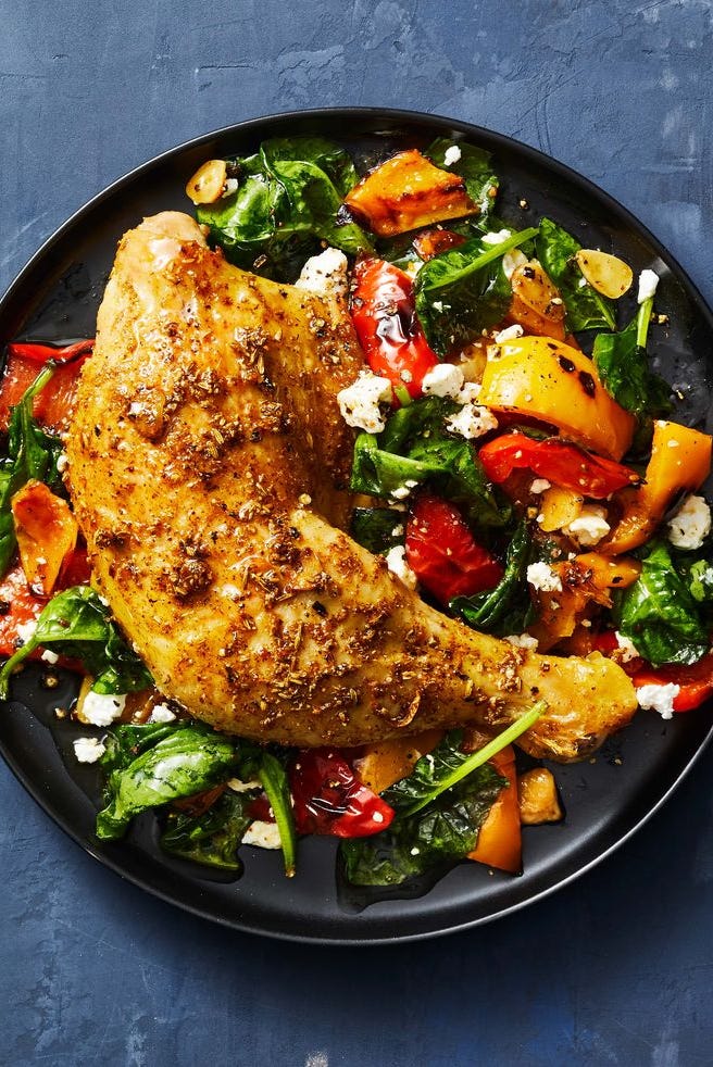 fennel roasted chicken and peppers on a black plate