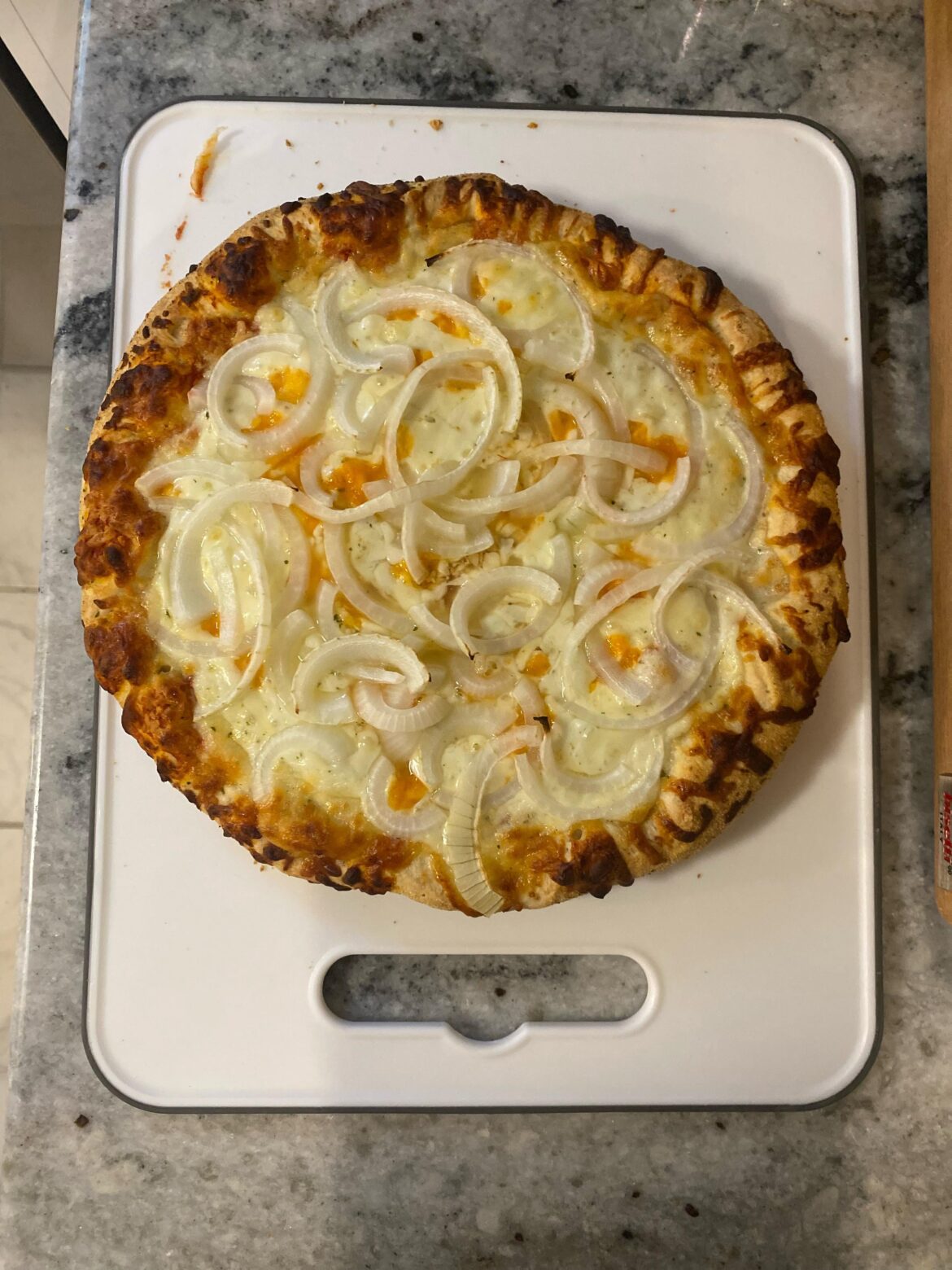 Frozen pizza night. Cheese pizza is a blank canvas