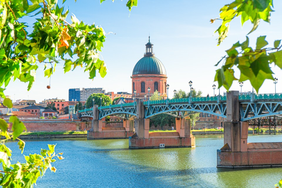 The Dome de la Grave and a bridge over the Garonne River in Toulouse, France.