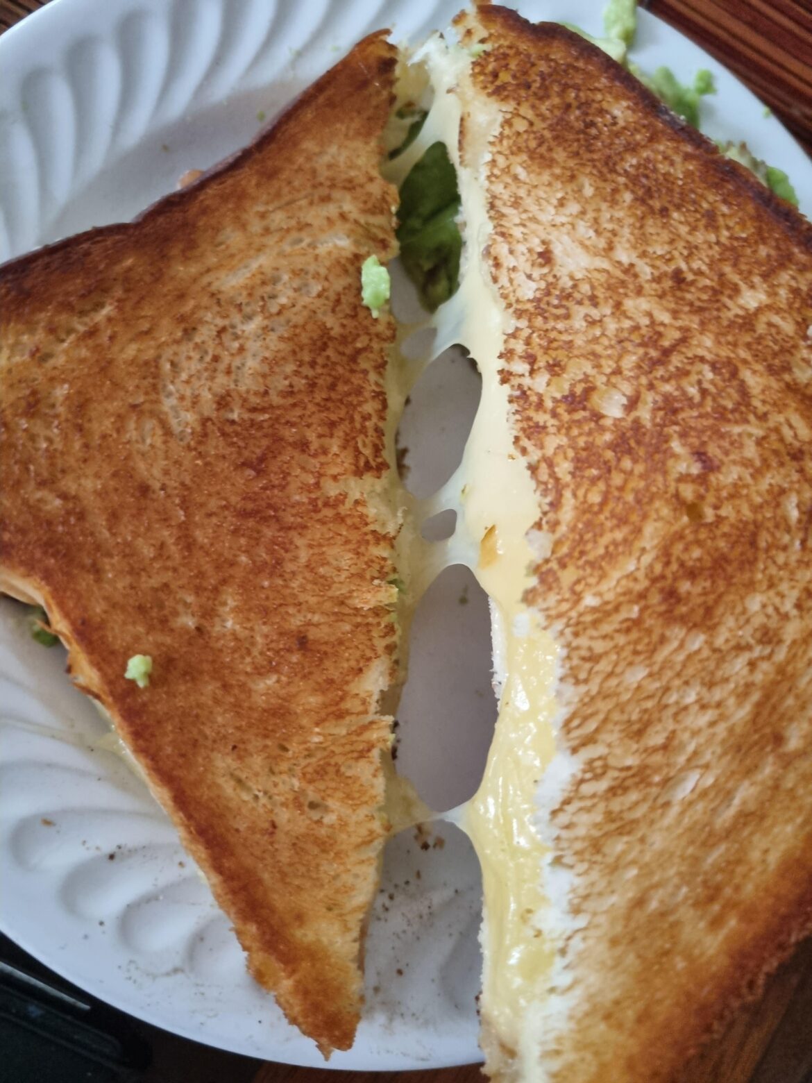 Cheddar grilled cheese with mashed avocado (avocado is OUTSIDE)