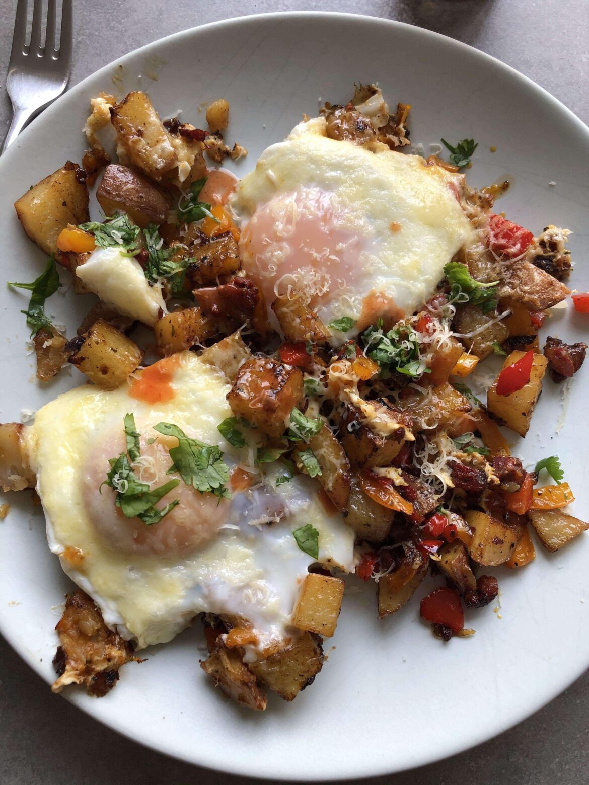 Chorizo, potatoes, onions, peppers, topped with two eggs