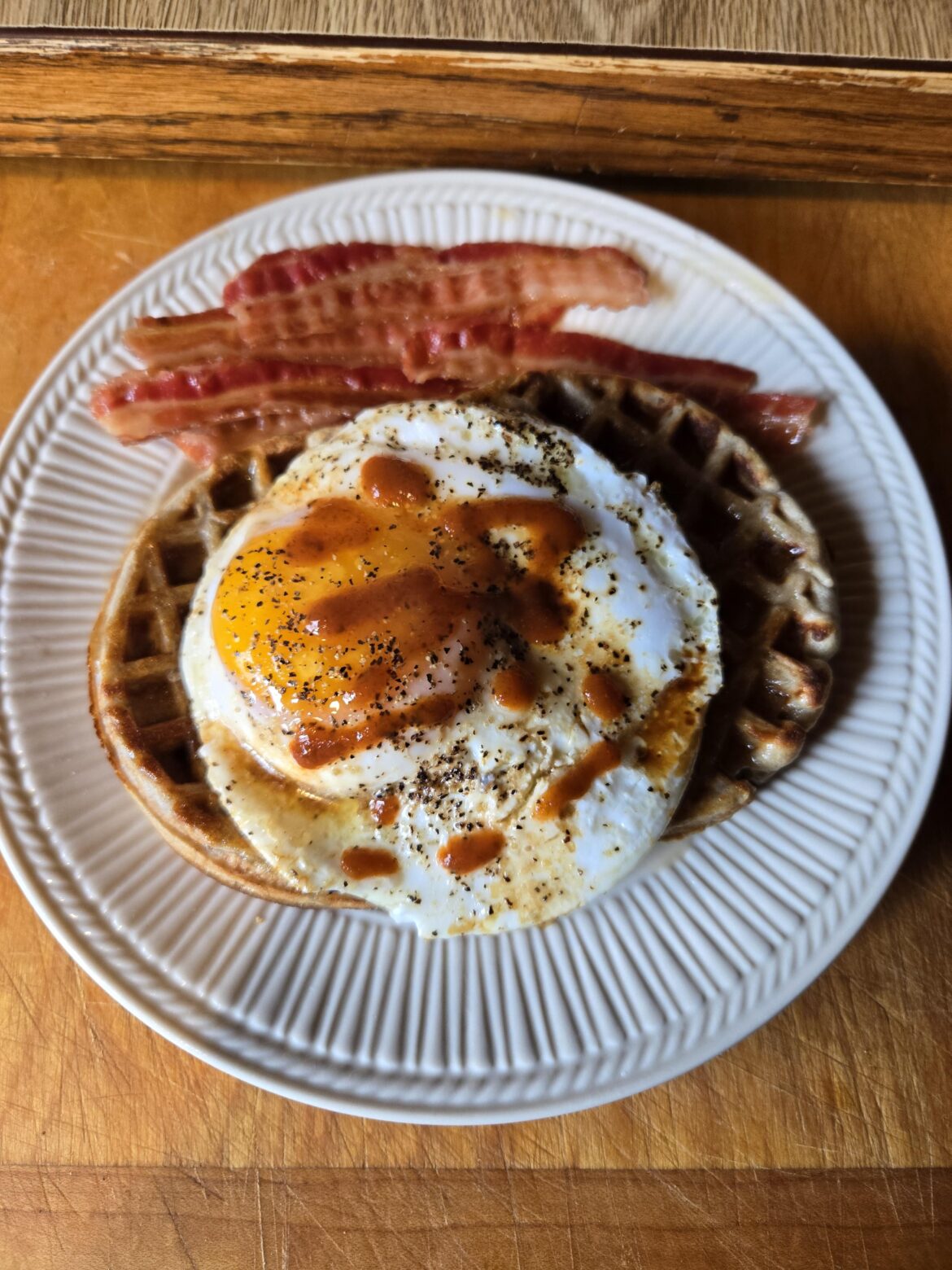 Duck egg on waffles & bacon