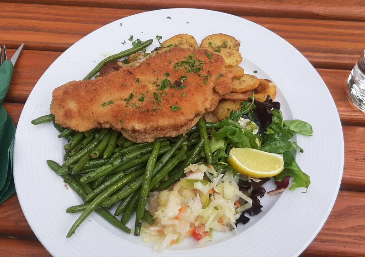 Schnitzel filled with liver paste, onions and mustard; together with fried potatoes and princess beans (Leipzig, Germany)