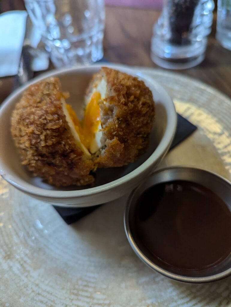 [I ate] Scotch egg and lamb sausage/mash at the Lamb and Flag in London.