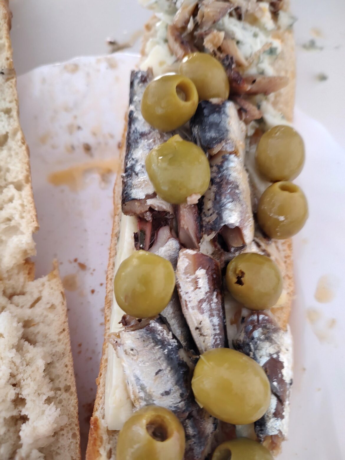 Rochefort cheese, spicy sardines soaked in wine vinegar and anchovy stuffed olives. All laid on a freshly baked baguette. Yay 😋 or nay 🤢.