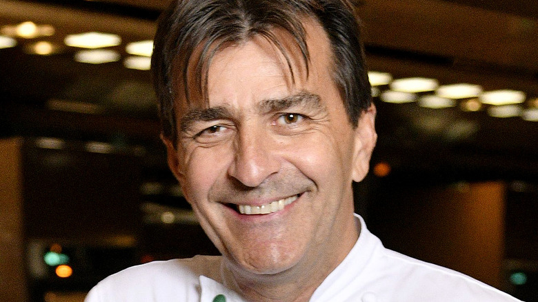 Yannick Alléno smiling at restaurant
