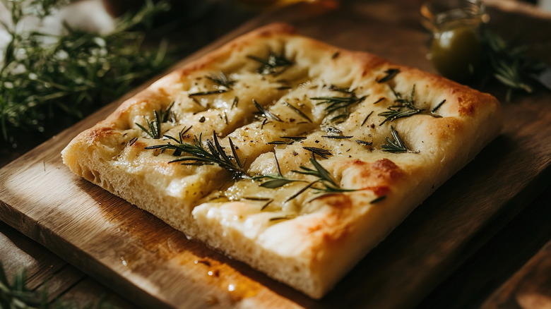 Focaccia slice on wood cutting board