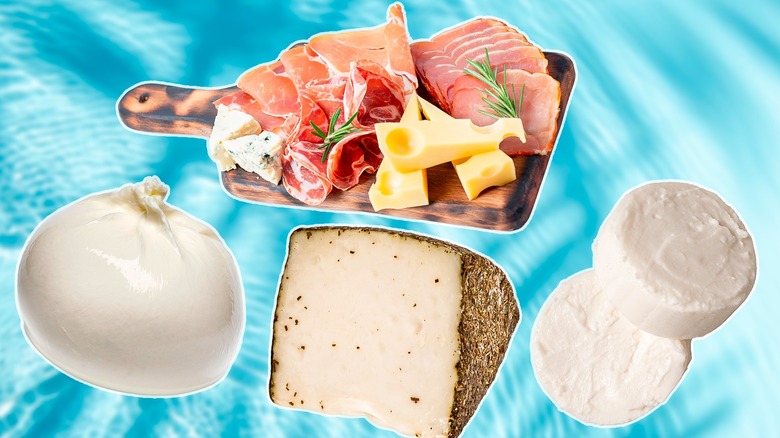 three types of cheese with charcuteries board on pool background