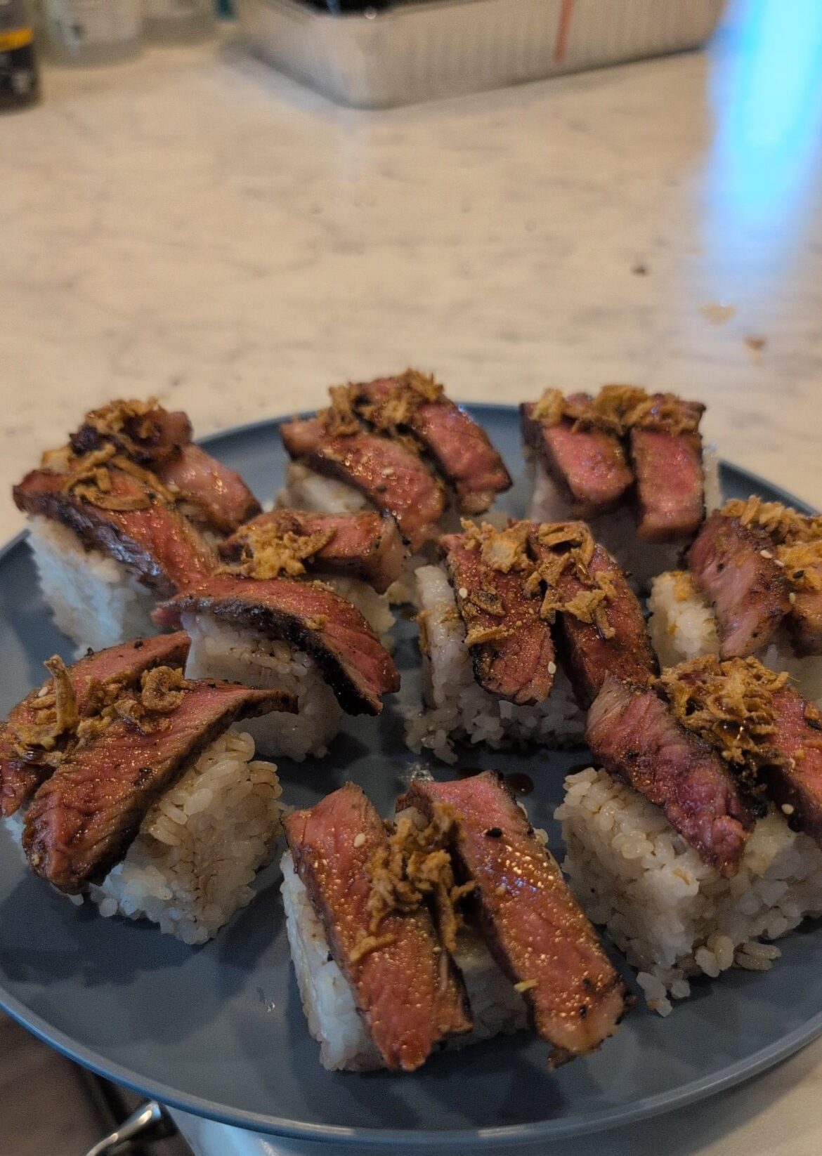 Wanted sushi but I hate seafood so I made some steak nigiri out of a new York strip. It came out so good and the steak was so tender!