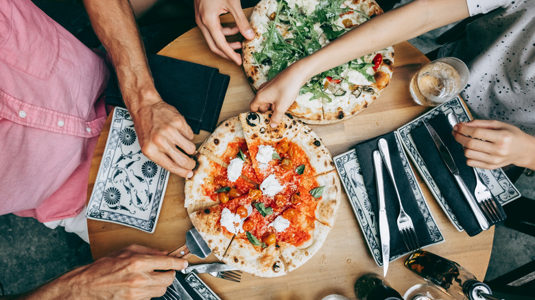 Family sharing pizza