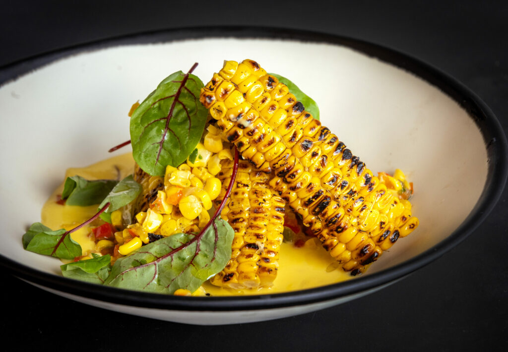 Charred Summer Corn Succotash with corn pudding from The Waterhawk Lake Club Thursday, August 14, 2025, in Rohnert Park. (John Burgess / The Press Democrat)