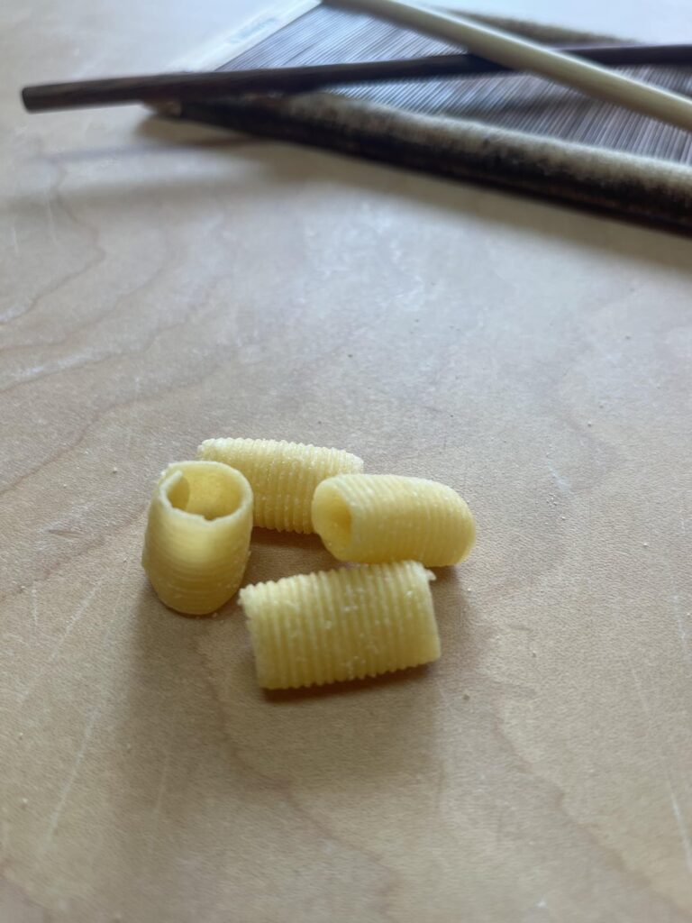 Mezze maccheroni al pettine with a tomato sauce and parmigiano