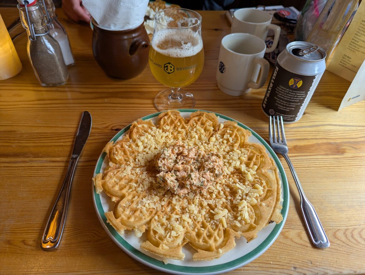 Swedish waffle with västerbotten cheese and a mix made from arctic char (rödingröra), in Helags mountain station