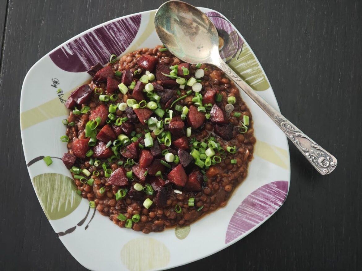 Three colored lentil stew with crunchy sausage