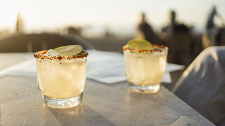 Two margaritas on outdoor table