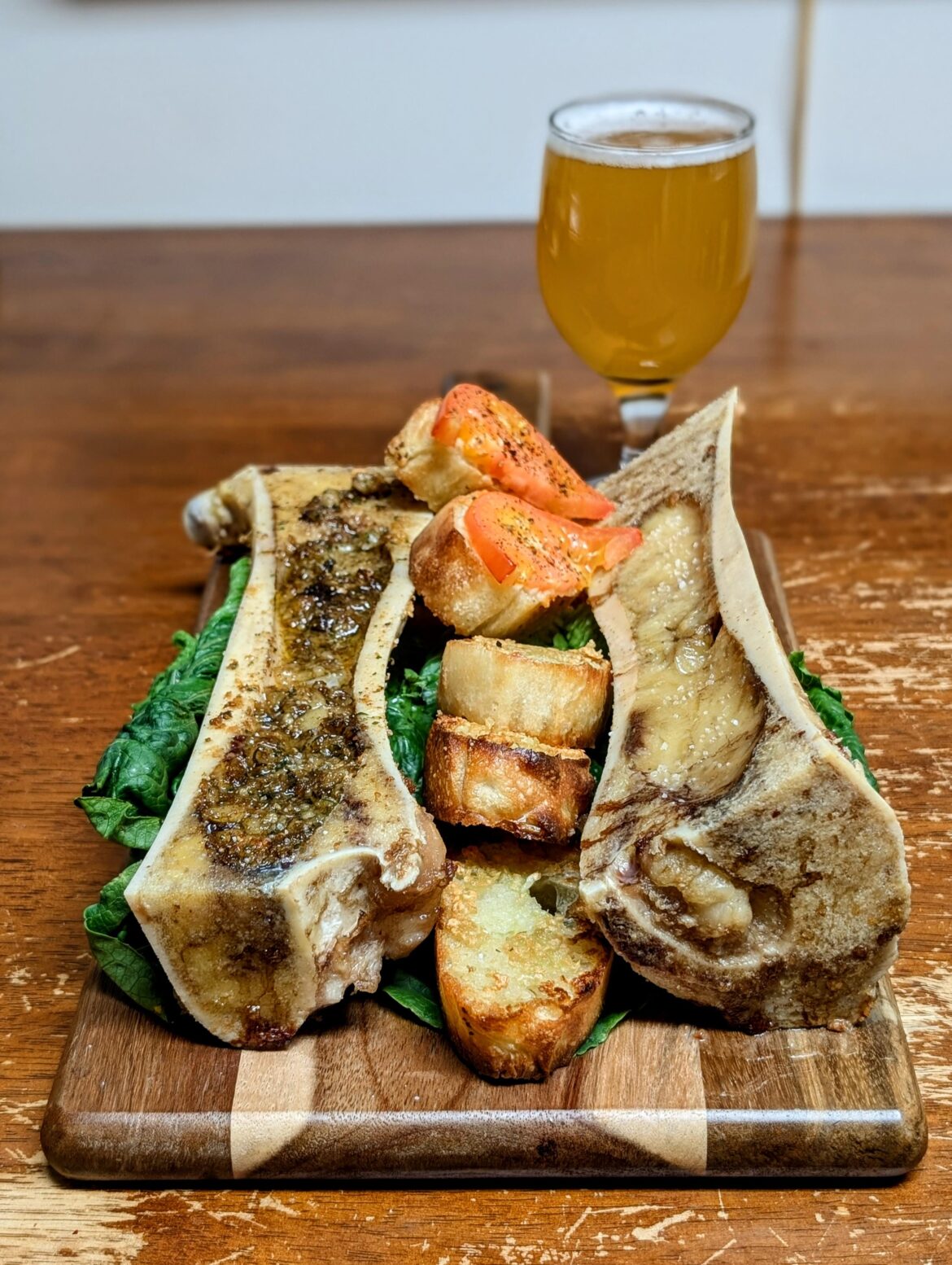 Roasted marrow fresh cut from my butcher, and garden fresh tomatoes over gruyere and sourdough baguette