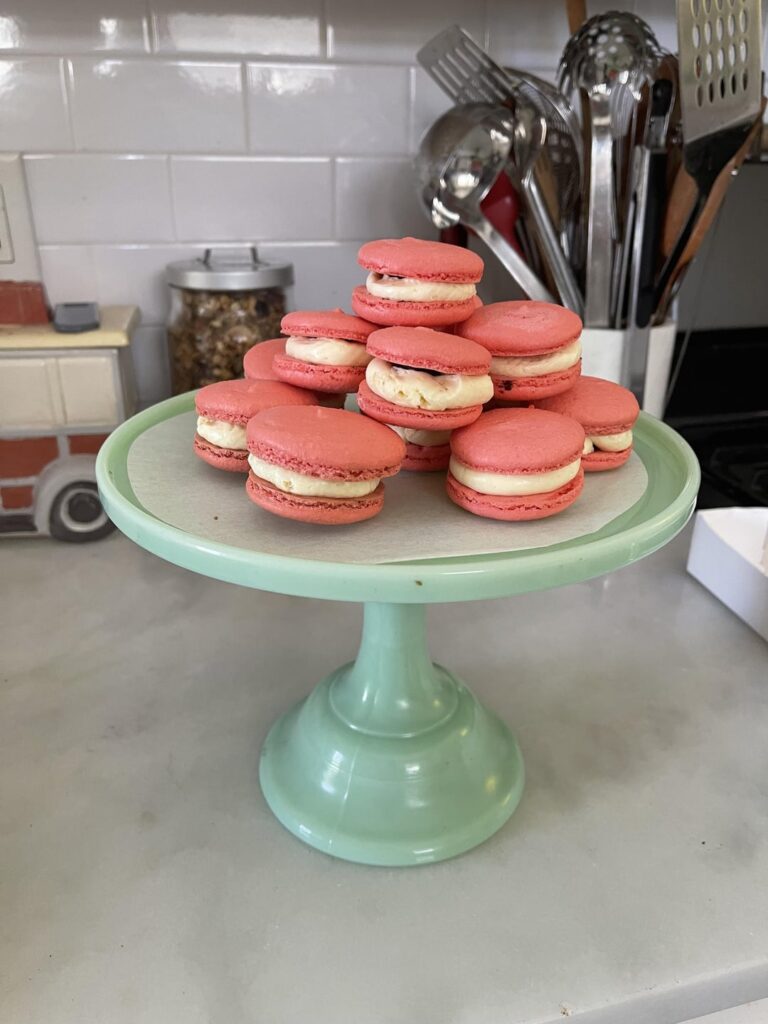 Macarons with cherry buttercream and chocolate ganache center