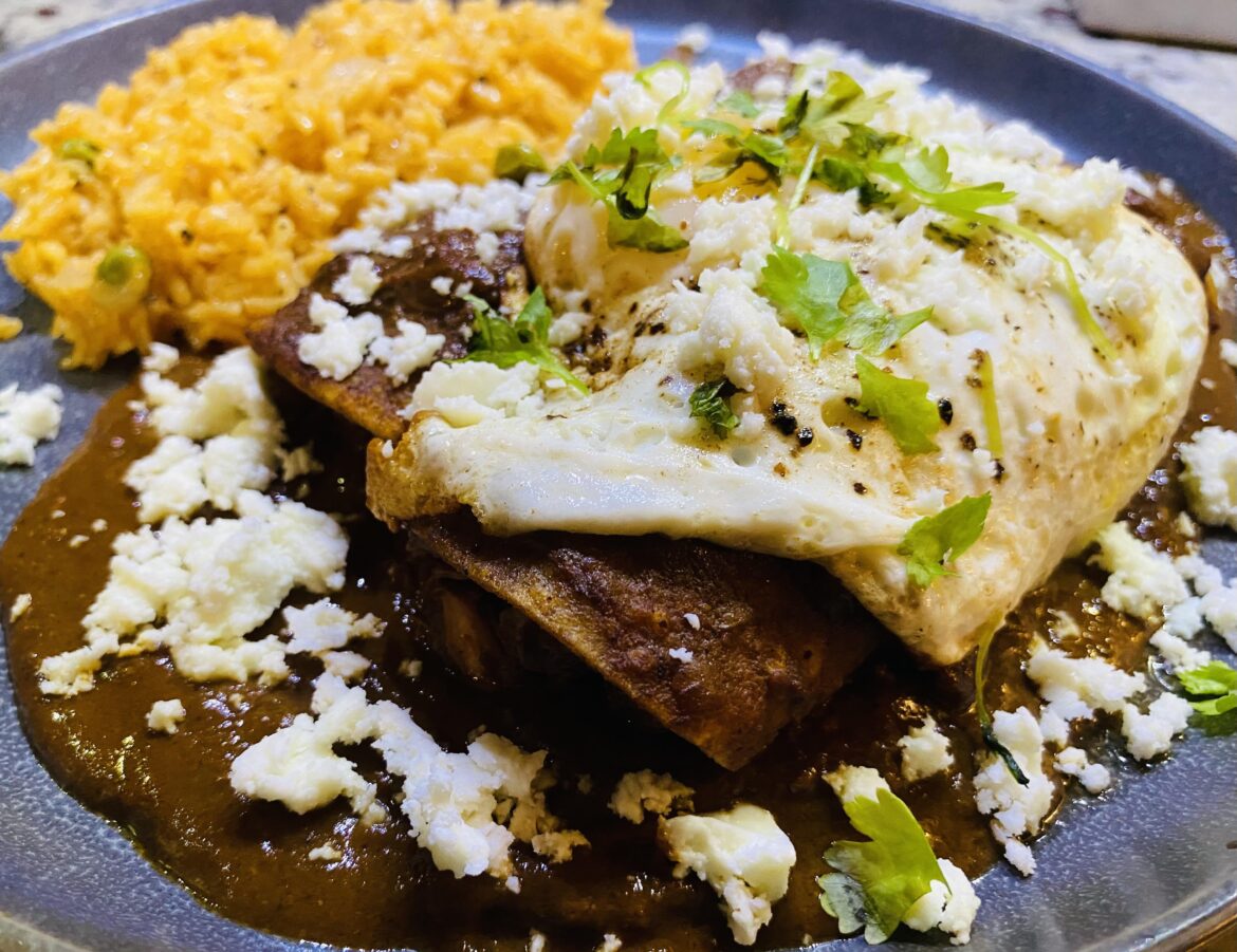 My wife made slow cooker mole with chicken thighs on Wednesday, and I took the leftovers and made enchiladas topped with queso fresco, a fried egg, and cilantro garnish (with Mexican rice both nights).