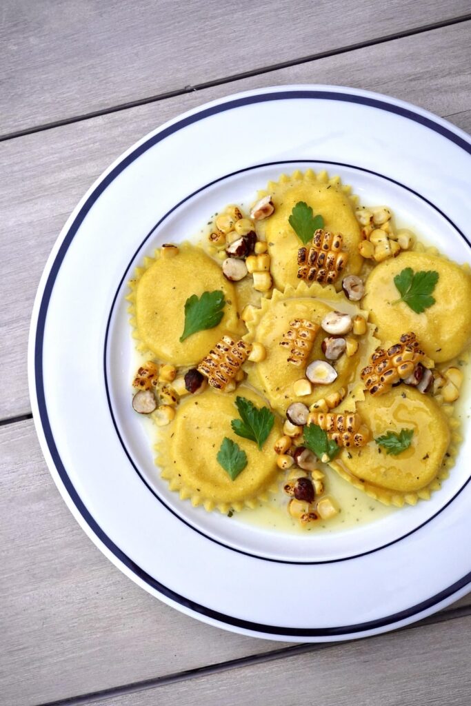 Ravioli of sweetcorn in a butter sauce, with roasted sweetcorn & hazelnut Ravioli of sweetcorn in a butter sauce, with roasted sweetcorn & hazelnut