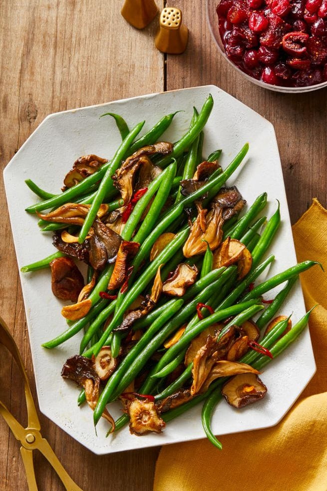 mushroom and chile garlic green beans on a white plate
