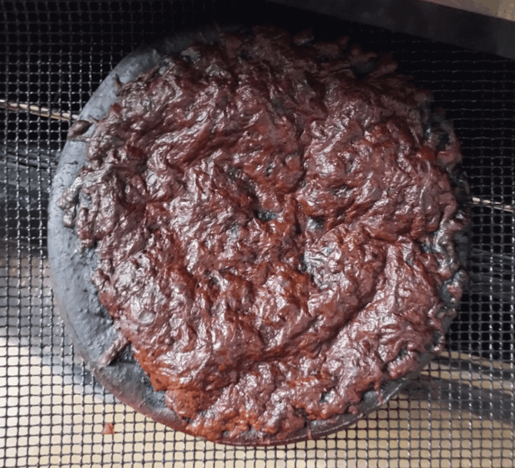 Homemade brownie. Recipe: put a pizza in an oven then fall asleep for 7 hours.