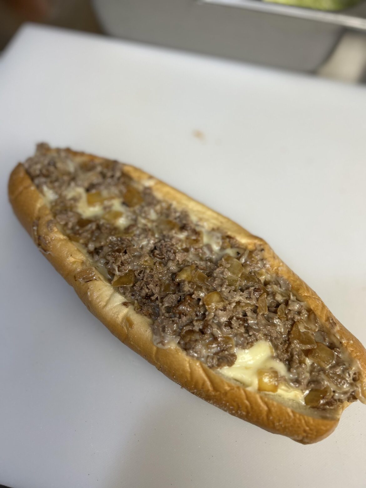 Heres a cheesesteak with the fried onions from earlier