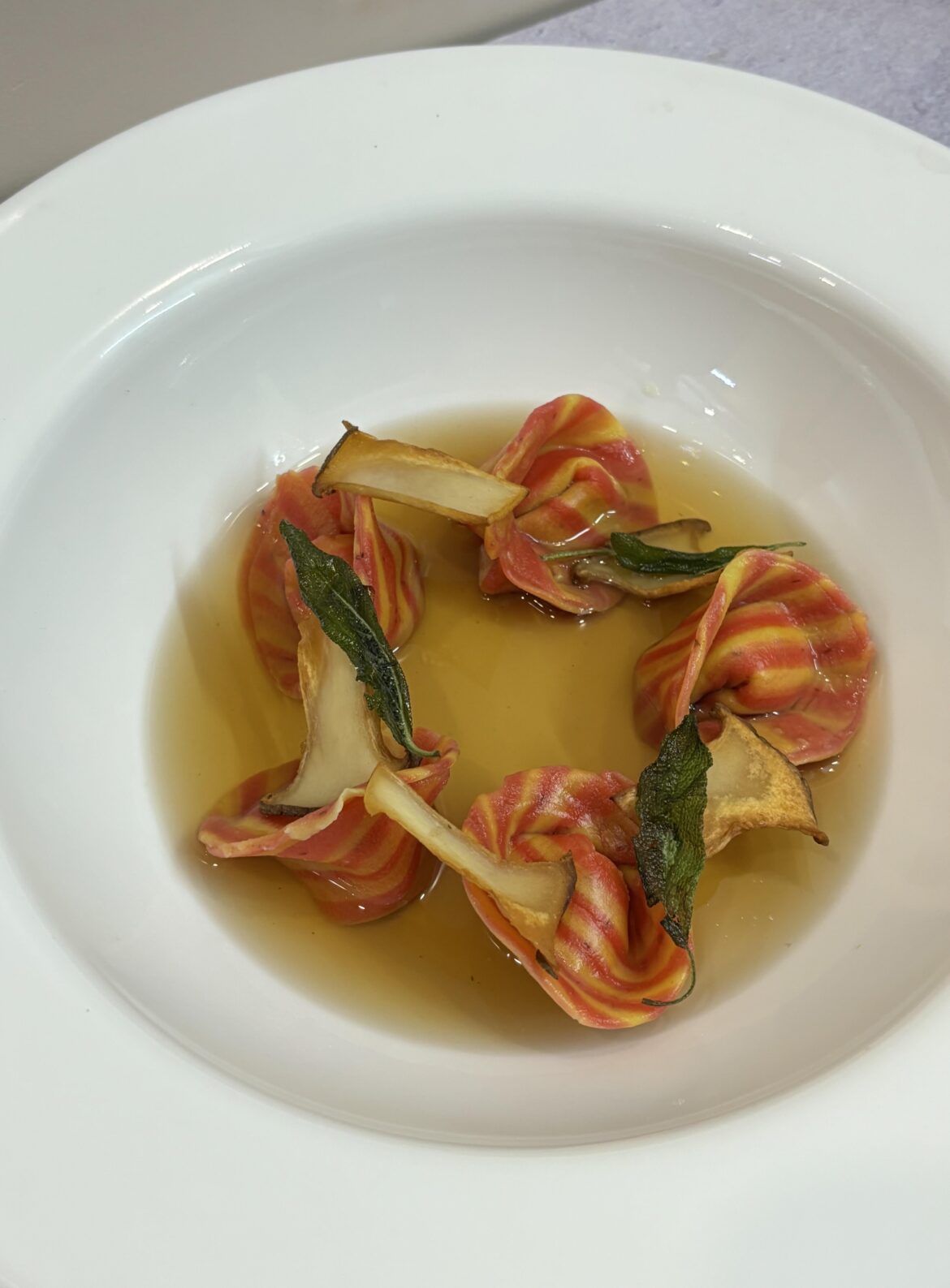 Tortellini/ goat cheese, prunes stuffing/ shiitake consomme