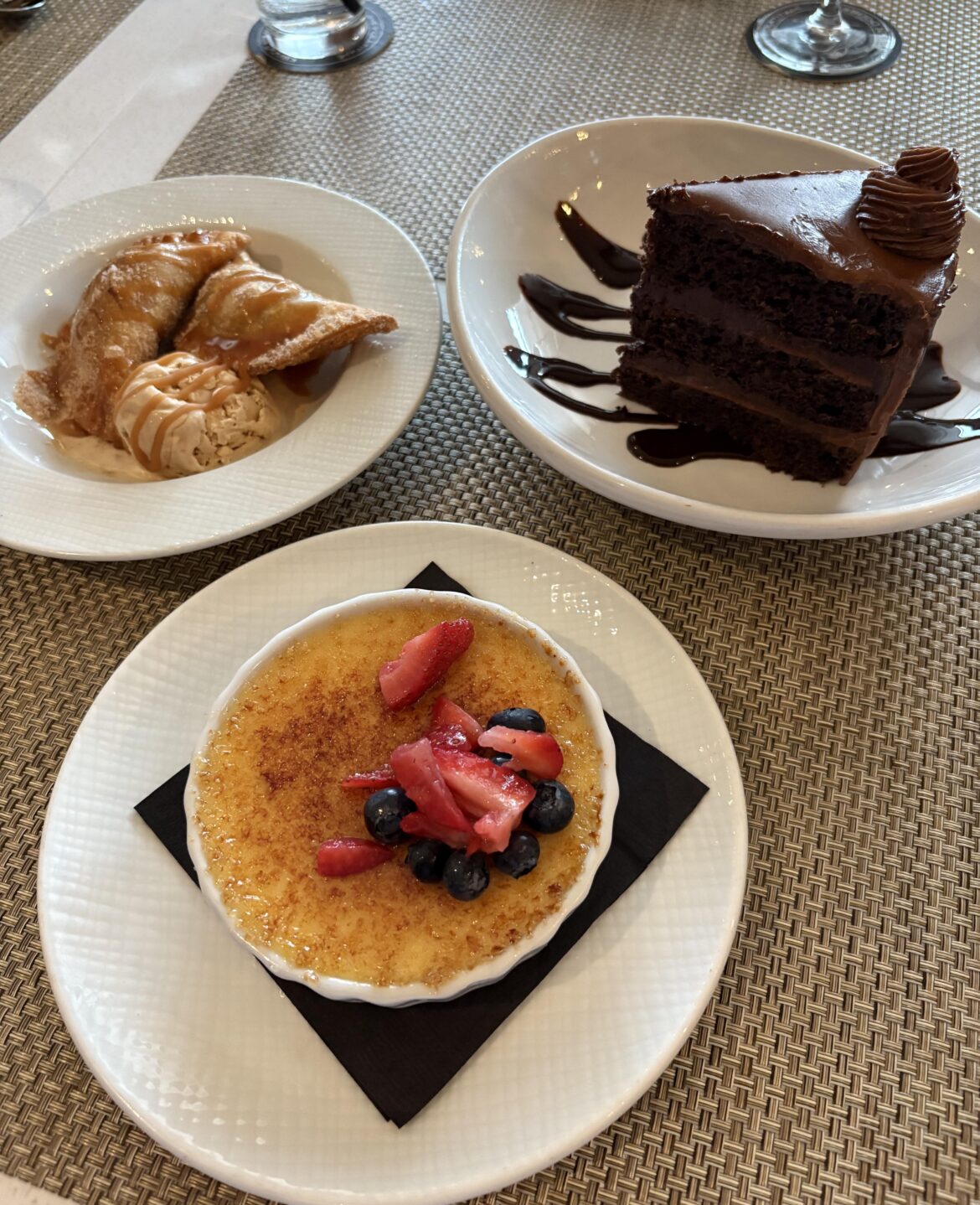 Hosted a business dinner. Dessert options were coming correct - Apple empanadas, Chocolate cake, crème brûlée