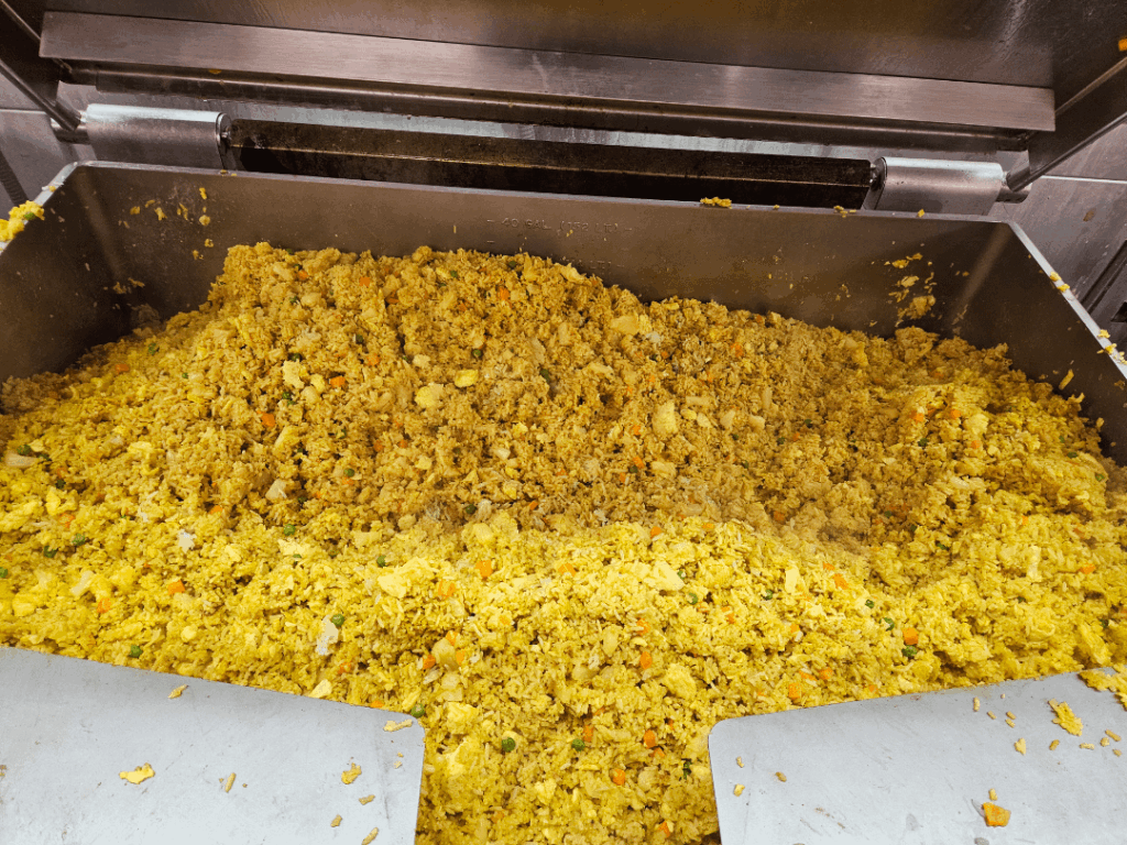 30ish gallons of pineapple curry fried rice. Ft yesterday's 40 gallon tilt skillet.