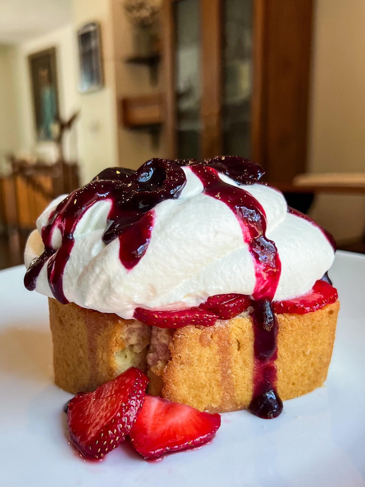 Brown butter pound cake, macerated strawberries, cream cheese whipped cream, black cherry compote